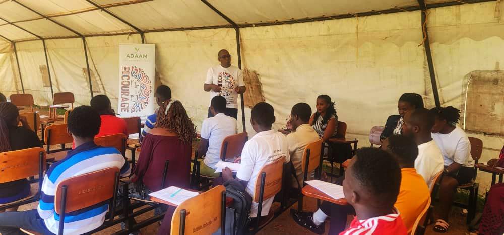 Community members at an ADAAM tent session