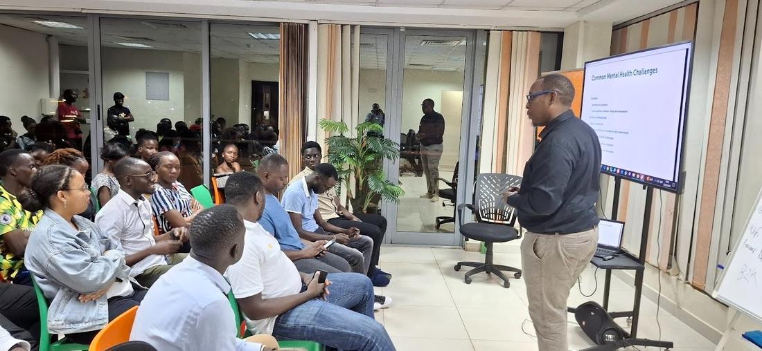 An ADAAM presenter leading a training room session
