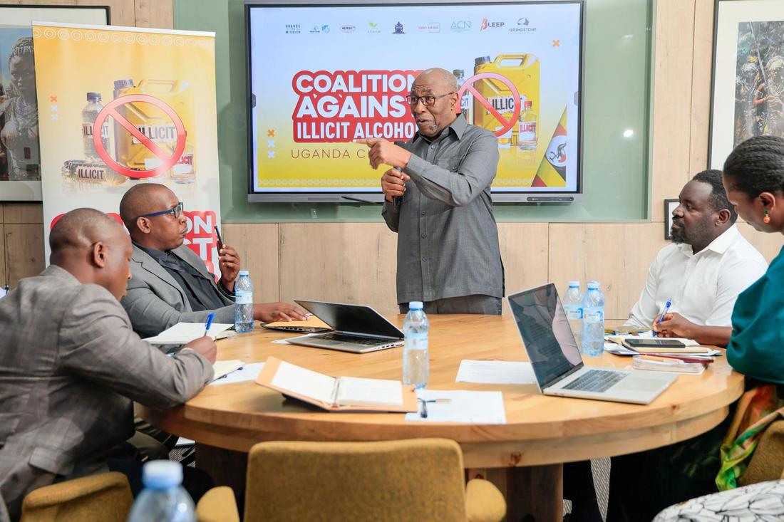 Dr. Ruhakana Rugunda with the ADAAM team at the coalition roundtable