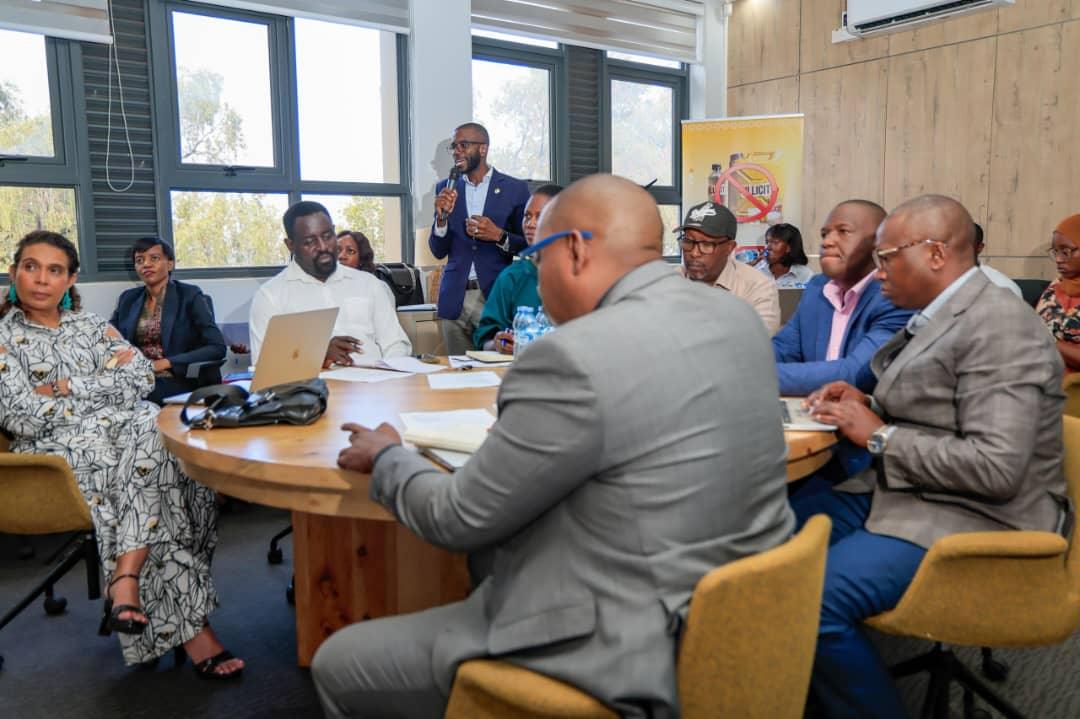 Coalition Against Illicit Alcohol partners around the table