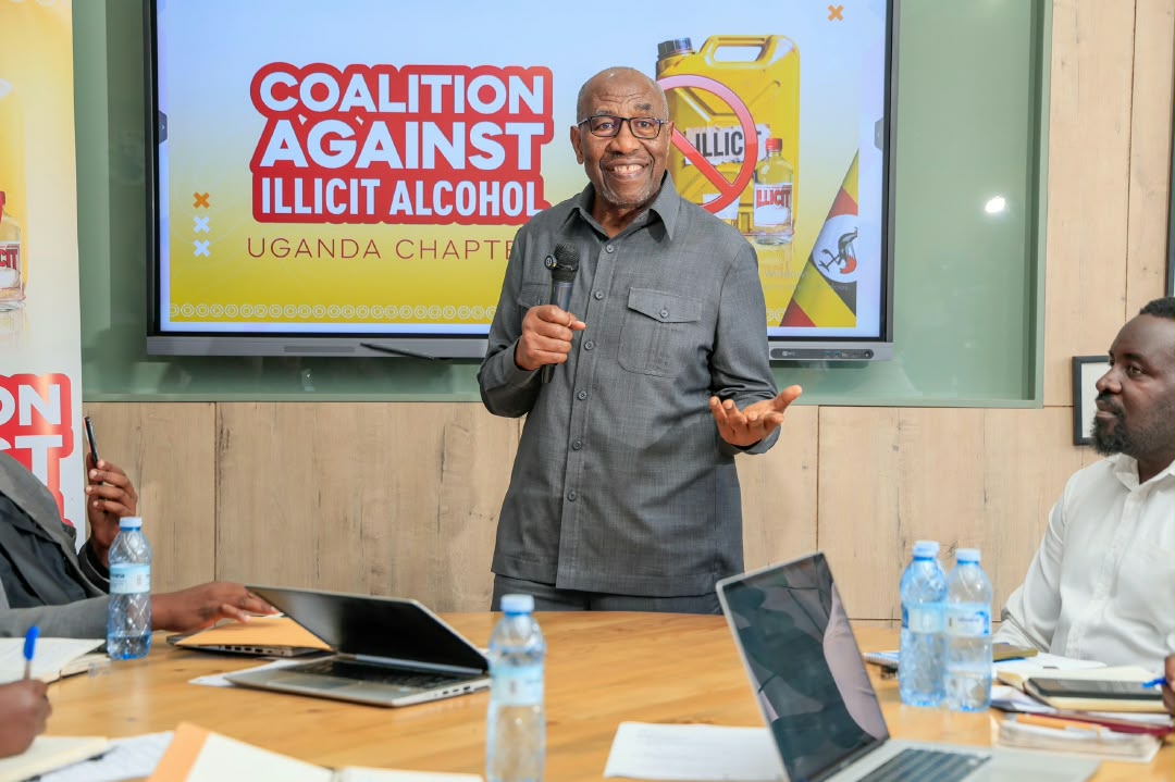 Dr. Ruhakana Rugunda addressing the Coalition Against Illicit Alcohol meeting