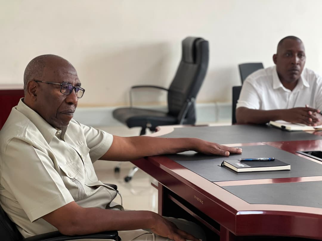Dr. Ruhakana Rugunda in discussion with the ADAAM team and partners